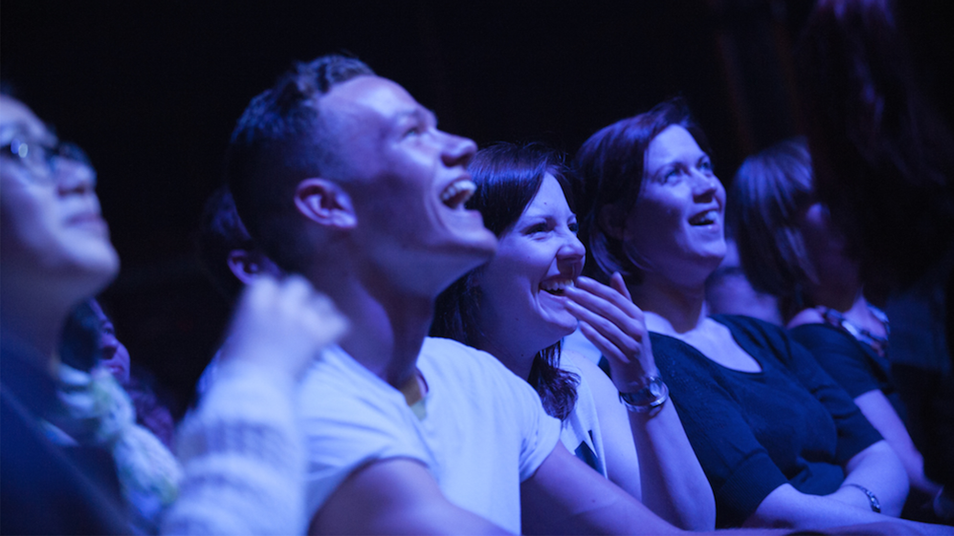 audience members laughing